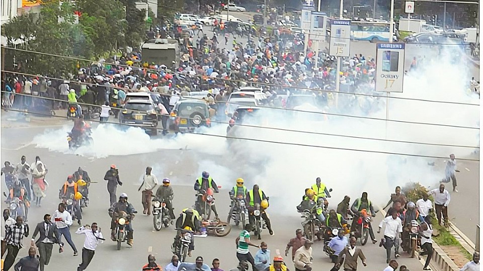 Boda Boda's in front background seen aheading the strike followed by the walking team in Kenya Nairobi Tax Protest, photo by Farouk Shivo